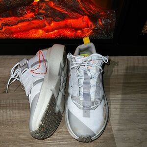 Nikes: White and Gray Sneakers with Orange Accents